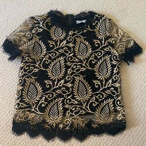 Anthropologie Black and Gold top